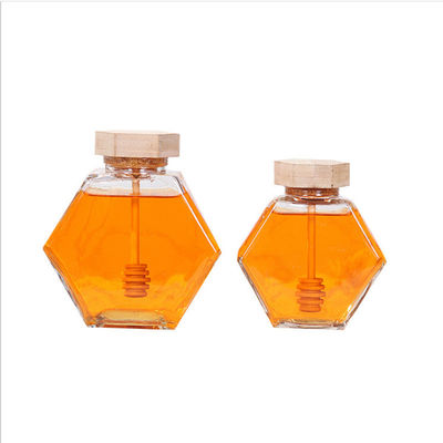 Hölzerner Dripper-hitzebeständiges Hexagon-Glas Honey Jar fournisseur